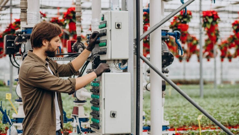 Technician performing PIM testing on telecom tower RF components